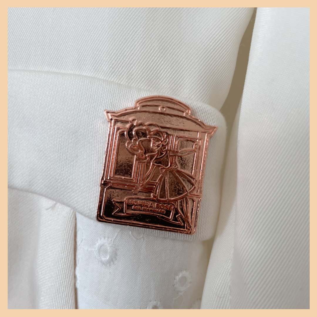 Jumpsuit Details: The Rose Gold Cable Car Emblem